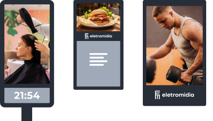 Painéis digitais anunciando salão de beleza, restaurante e academia.